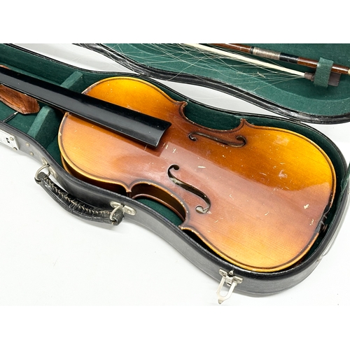 593 - A violin in case.