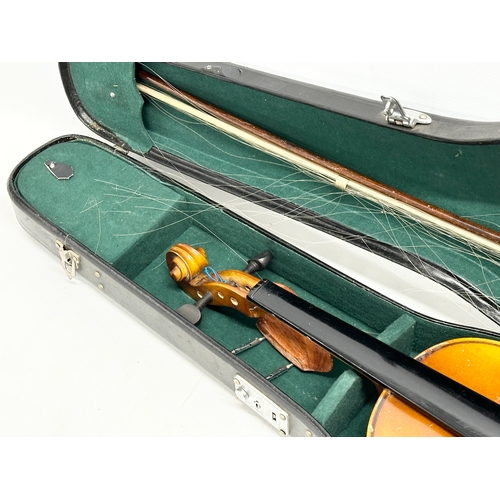 593 - A violin in case.