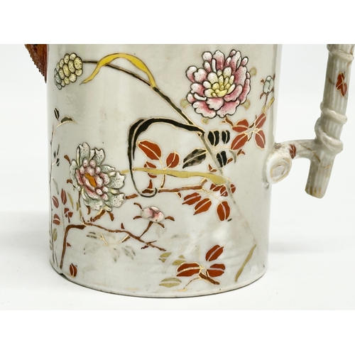 313 - A 19th Century Japanese hand painted chocolate pot/teapot. With bamboo design handle and embossed fl... 