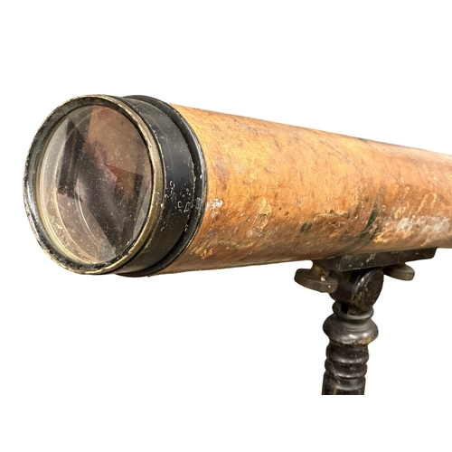 323 - A 19th/Early 20th Century leather bound telescope on tripod. 150cm