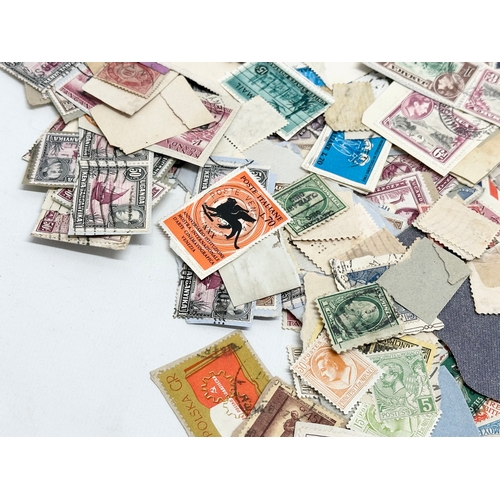 597 - A large collection of stamps. British, Canadian, Italian, India etc