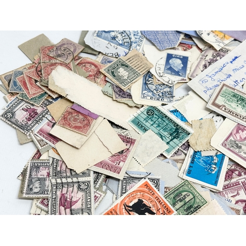 597 - A large collection of stamps. British, Canadian, Italian, India etc