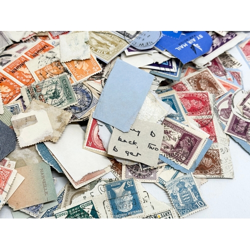 597 - A large collection of stamps. British, Canadian, Italian, India etc