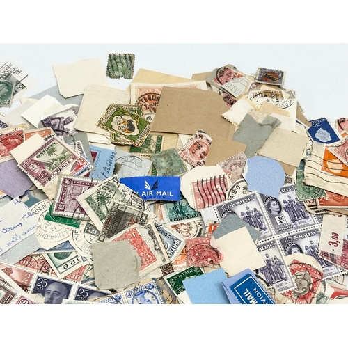 597 - A large collection of stamps. British, Canadian, Italian, India etc