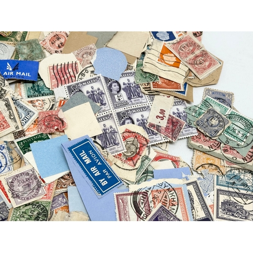 597 - A large collection of stamps. British, Canadian, Italian, India etc