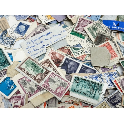 597 - A large collection of stamps. British, Canadian, Italian, India etc