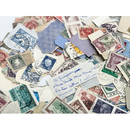 597 - A large collection of stamps. British, Canadian, Italian, India etc