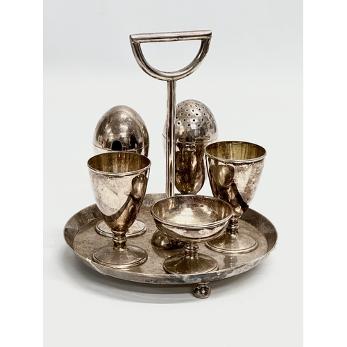 30 - A Late 19th Century Hukin & Heath silver plated breakfast set/egg set by Christopher Dresser.