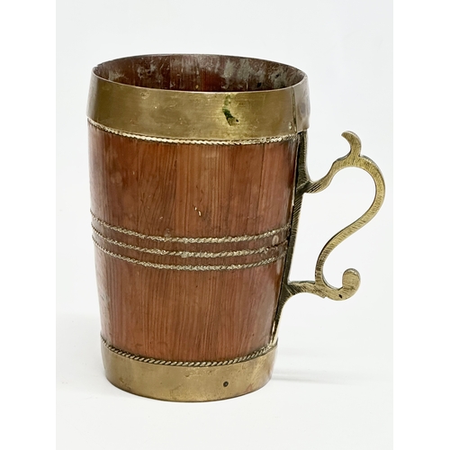 381 - A Late 19th Century Victorian brass bound Yew wood tankard. 12x8.5x13cm