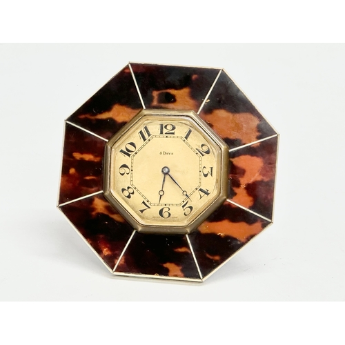 395 - An Art Deco faux tortoiseshell 8 Day desktop clock. 10x10cm