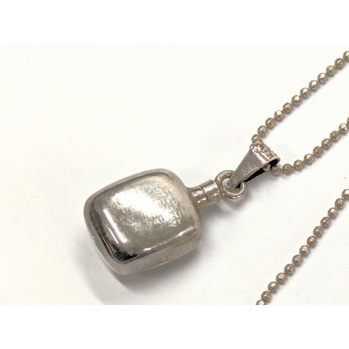 484 - A silver scent bottle on chain