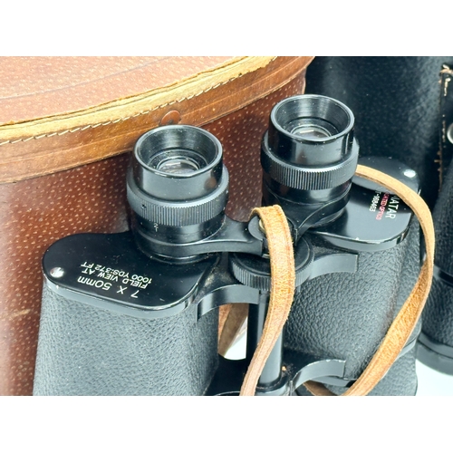 615 - 2 pairs of binoculars with cases.