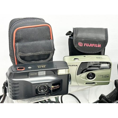 621 - A quantity of cameras. An Olympus Superzoom 700XB camera with case. A Fuji DL15 camera with case. A ... 