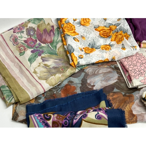 628 - A collection of vintage silk scarves.