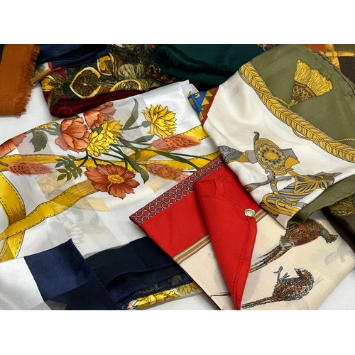 629 - A large collection of vintage scarves.