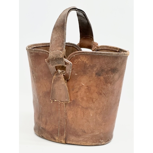 360 - A 1930’s Norris leather bucket bag/carrier. 27x28x24cm