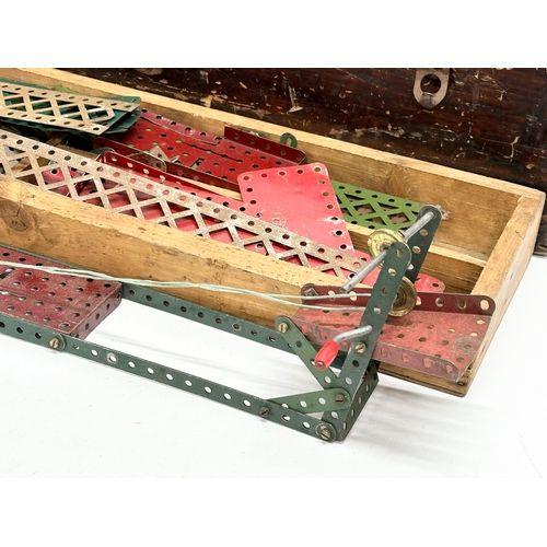 634 - A large collection of vintage Meccano. wooden box measures 65x20x23cm