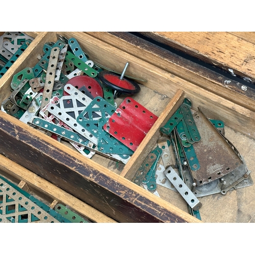 634 - A large collection of vintage Meccano. wooden box measures 65x20x23cm