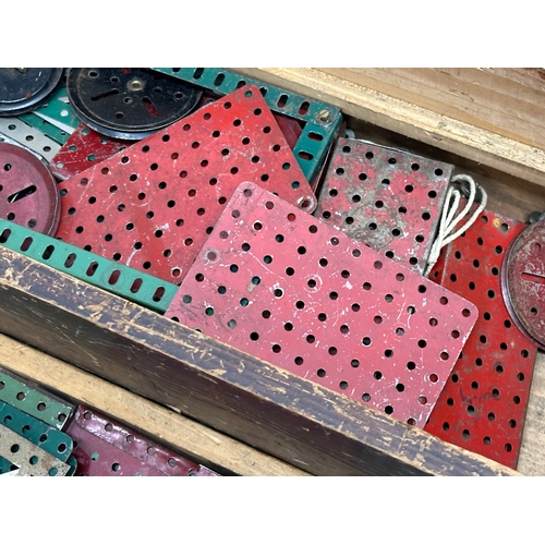 634 - A large collection of vintage Meccano. wooden box measures 65x20x23cm