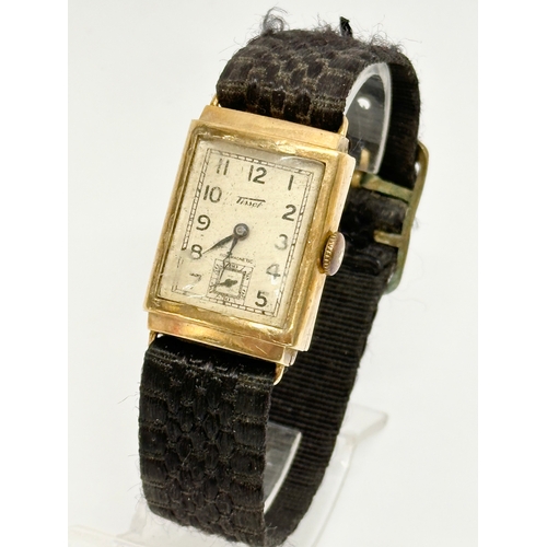 461H - A vintage 9ct gold watch by Tissot.