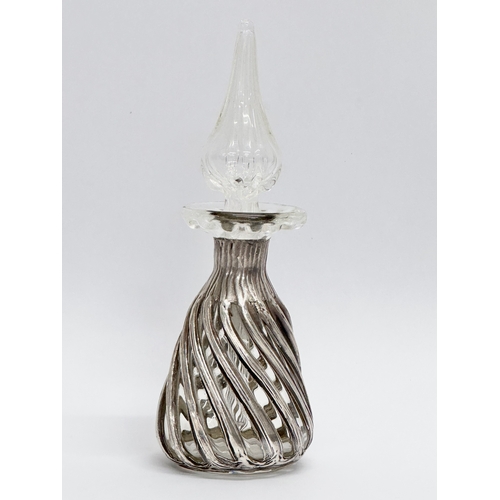 469A - A 19th Century Irish silver and glass scent bottle. 13cm