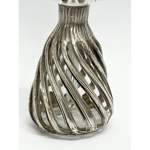 469A - A 19th Century Irish silver and glass scent bottle. 13cm