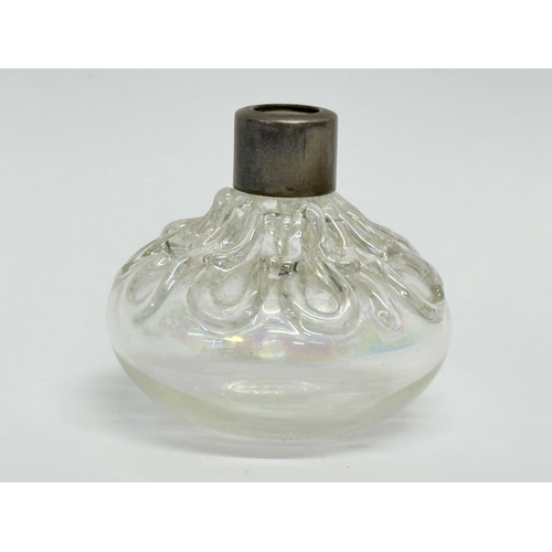 469B - A silver rimmed iridescent glass scent bottle. Birmingham mark. 5.5x5cm