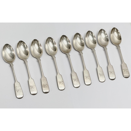 469C - A set of 9 19th Century silver spoons. Exeter 1875. Stamped JW.Co. 220 grams. 15cm