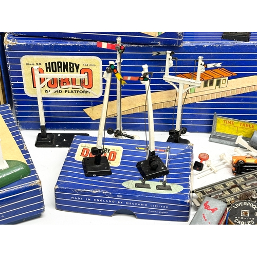 427 - A large collection of Hornby Dublo train settings, buildings etc.