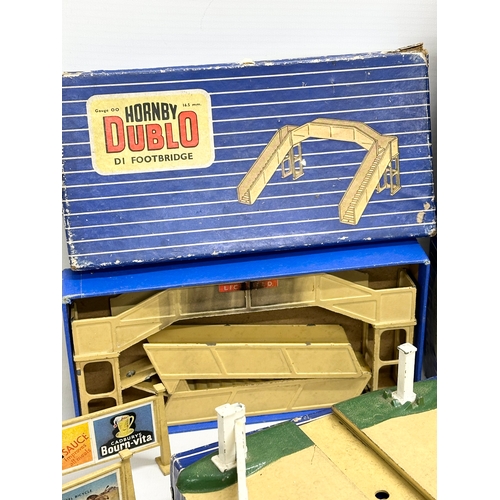 427 - A large collection of Hornby Dublo train settings, buildings etc.