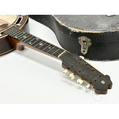 637 - A good quality vintage inlaid rosewood mandolin with case.