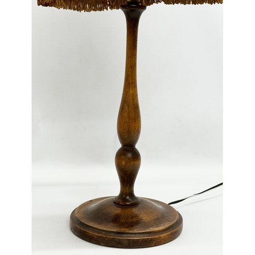 646 - 2 Early 20th Century turned wood table lamps. 47cm