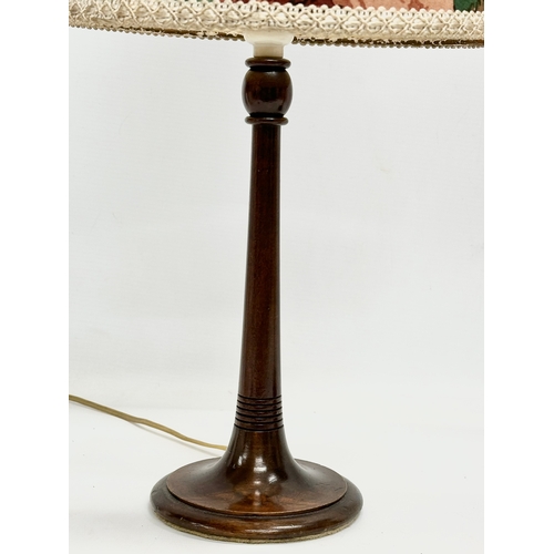 646 - 2 Early 20th Century turned wood table lamps. 47cm