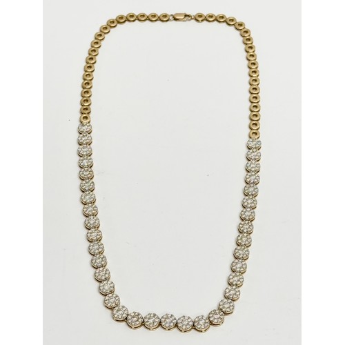 460A - An 18ct gold and diamond collarette necklace. 7.18ct Diamond. 29.1 grams total.