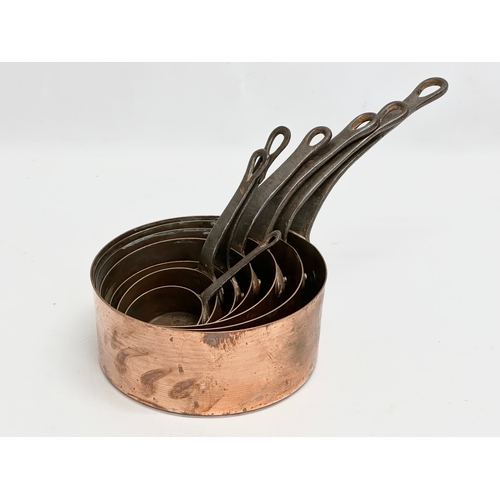 60D - A set of 7 Victorian copper pans. Largest 39x18.5x17cm