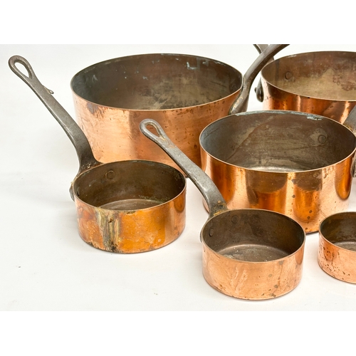 60D - A set of 7 Victorian copper pans. Largest 39x18.5x17cm