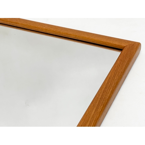 356A - A G-Plan Mid Century teak framed mirror. 55x69cm