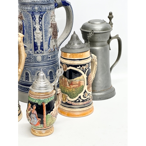 643 - A collection of large Late 19th and Early 20th Century German beer steins. A large Westerwald salt g... 