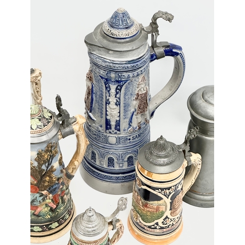 643 - A collection of large Late 19th and Early 20th Century German beer steins. A large Westerwald salt g... 