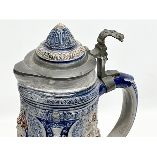 643 - A collection of large Late 19th and Early 20th Century German beer steins. A large Westerwald salt g... 