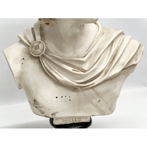 650 - A large heavy resin bust of Apollo on stand. 36x55cm