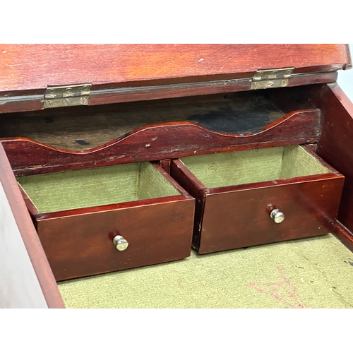 679 - A Victorian mahogany tabletop fitted writing slope.  36x41x17cm.