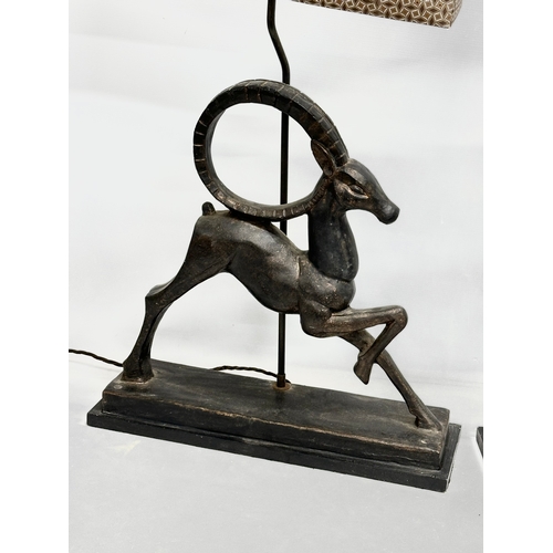 719 - A pair of large gazelle table lamps. 51x16x88cm