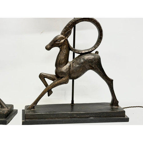 719 - A pair of large gazelle table lamps. 51x16x88cm