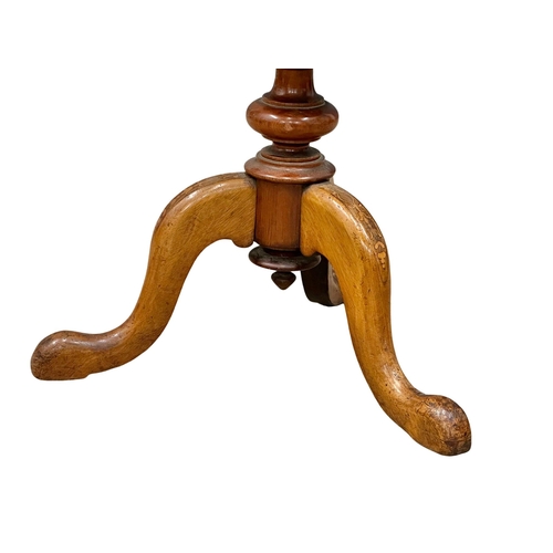 824 - A Victorian inlaid walnut trumpet work table. 42x42x73cm.