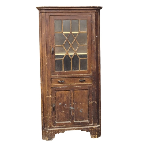 1006 - A Late George III pine corner cabinet with original paintwork, astragal glazed door, and drawer. 91x... 