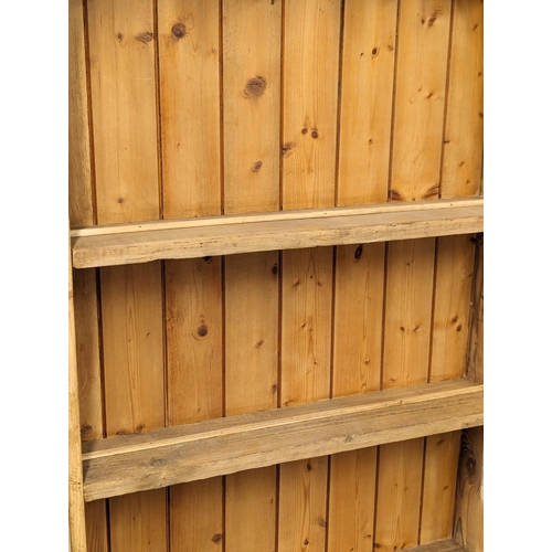 1011 - A pine dresser made from reclaimed wood. 72.5x23.5x194cm