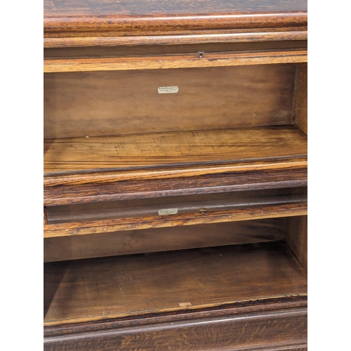 801 - An Early 20th Century Globe - Wernicke Co. Ltd oak stacking bookcase. 86.5x35.5x104.5cm