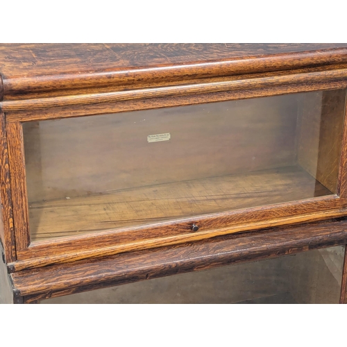 801 - An Early 20th Century Globe - Wernicke Co. Ltd oak stacking bookcase. 86.5x35.5x104.5cm