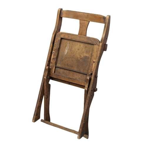 815 - A set of 4 Early 20th Century church folding chairs by The Drifter.